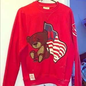 A red designer sweater